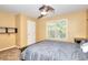 Bedroom featuring a queen bed with a gray comforter, a window, carpet flooring, and neutral walls at 1615 Mount Mckinley Dr, Grayson, GA 30017