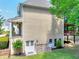 View of the home's rear showcasing the basement entrance, upper deck, and low-maintenance yard at 1615 Mount Mckinley Dr, Grayson, GA 30017