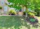 Attractive home boasting a manicured lawn, vibrant shrubbery, and a stone-lined garden area with blooming flowers at 1615 Mount Mckinley Dr, Grayson, GA 30017