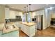 Bright eat-in kitchen with stainless appliances, granite counters, and a butcher block island at 1615 Mount Mckinley Dr, Grayson, GA 30017