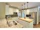 Bright kitchen with stainless steel appliances, granite countertops, a butcher block island, and ample cabinet space at 1615 Mount Mckinley Dr, Grayson, GA 30017