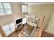 Two-story living room with cozy fireplace, built-in shelving, high windows, and comfortable seating at 1615 Mount Mckinley Dr, Grayson, GA 30017