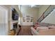 Spacious living room with a fireplace, hardwood floors, built in shelves, and large windows for natural light at 1615 Mount Mckinley Dr, Grayson, GA 30017