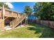 The backyard includes a spacious deck and stairs leading to a lush lawn at 1661 Barrett Nw Dr, Atlanta, GA 30318