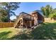 Backyard featuring a deck, stairs, and a lush lawn is a great place to enjoy the outdoors at 1661 Barrett Nw Dr, Atlanta, GA 30318