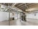 Unfinished basement with painted walls and exposed ceiling featuring a washer, dryer, and mechanical equipment at 1661 Barrett Nw Dr, Atlanta, GA 30318