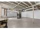 Unfinished basement with painted walls and ceiling, concrete floor, and mechanical equipment at 1661 Barrett Nw Dr, Atlanta, GA 30318