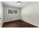 Bedroom with hardwood floors and a large window that provides lots of natural light at 1661 Barrett Nw Dr, Atlanta, GA 30318