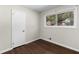 Cozy bedroom features hardwood floors, natural lighting, and neutral paint at 1661 Barrett Nw Dr, Atlanta, GA 30318