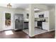 Open concept kitchen, with stainless steel appliances and access to an outdoor deck at 1661 Barrett Nw Dr, Atlanta, GA 30318