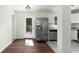 A modern kitchen with stainless steel appliances, light countertops and hardwood floors at 1661 Barrett Nw Dr, Atlanta, GA 30318