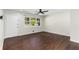 Cozy living room features hardwood flooring, a ceiling fan, and natural light at 1661 Barrett Nw Dr, Atlanta, GA 30318