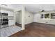 Open-concept layout of updated kitchen and living room space with hardwood floors and natural light at 1661 Barrett Nw Dr, Atlanta, GA 30318