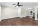 Bright living room with gleaming hardwood floors, ceiling fan and lots of natural light at 1661 Barrett Nw Dr, Atlanta, GA 30318
