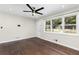 Bright living area featuring hardwood flooring and a large picture window at 1661 Barrett Nw Dr, Atlanta, GA 30318