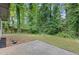 View of the natural backyard and patio space, ready for outdoor entertaining at 353 Old Rosser Rd, Stone Mountain, GA 30087