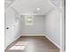 Open basement area with a utility closet and a small window offering natural light at 353 Old Rosser Rd, Stone Mountain, GA 30087