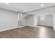 Spacious basement area with a stairway, recessed lighting, and newly finished floors at 353 Old Rosser Rd, Stone Mountain, GA 30087