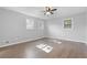 Bedroom featuring new floors, fresh paint, ceiling fan, and lots of natural light at 353 Old Rosser Rd, Stone Mountain, GA 30087
