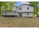 Back of house, showcasing the large yard and back patio, with fresh exterior paint at 353 Old Rosser Rd, Stone Mountain, GA 30087
