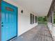 Charming front porch with blue door, offering a warm welcome with classic details and ample space at 353 Old Rosser Rd, Stone Mountain, GA 30087