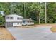 Beautiful home with fresh exterior paint, an inviting front porch and updated driveway at 353 Old Rosser Rd, Stone Mountain, GA 30087