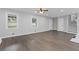 Bright living room with hardwood floors and staircase provides a welcoming space with ample natural light at 353 Old Rosser Rd, Stone Mountain, GA 30087