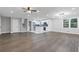 Open floor plan view with fireplace, stairs, new flooring and updated kitchen at 353 Old Rosser Rd, Stone Mountain, GA 30087