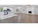 The home features a large living area, flowing into an open kitchen and centered by a fireplace at 353 Old Rosser Rd, Stone Mountain, GA 30087