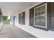 Home's covered porch, showcasing the inviting space with window views and classic architectural details at 353 Old Rosser Rd, Stone Mountain, GA 30087