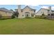 View of the home's backyard, lawn, garden, and facade at 5130 Hopewell Manor Dr, Cumming, GA 30028