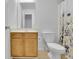 Bathroom features vanity with a large mirror and a toilet at 5130 Hopewell Manor Dr, Cumming, GA 30028