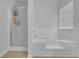 Bright bathroom featuring a tub and shower with glass door at 5130 Hopewell Manor Dr, Cumming, GA 30028