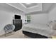Cozy bedroom featuring a tray ceiling, plush bed, and ample closet space at 5130 Hopewell Manor Dr, Cumming, GA 30028