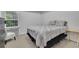 Bedroom featuring neutral tones and a full-size bed at 5130 Hopewell Manor Dr, Cumming, GA 30028