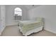 Bright bedroom with a large window and a comfortable bed at 5130 Hopewell Manor Dr, Cumming, GA 30028