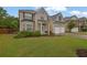 Attractive two-story home with a manicured lawn and a convenient two-car garage at 5130 Hopewell Manor Dr, Cumming, GA 30028