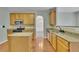 Modern kitchen with wooden cabinets, granite countertops and stainless steel appliances at 5130 Hopewell Manor Dr, Cumming, GA 30028