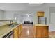 Bright kitchen featuring stainless steel appliances, granite countertops, and wood cabinets and island at 5130 Hopewell Manor Dr, Cumming, GA 30028