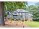 Charming Tudor-style home with beautiful brickwork and lush landscaping in a wooded setting at 5460 Lichenhearth Ct, Stone Mountain, GA 30087