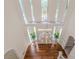 Elegant foyer featuring a chandelier, hardwood floors, and a staircase, with high ceilings at 5460 Lichenhearth Ct, Stone Mountain, GA 30087