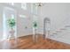 Grand foyer with hardwood floors, high ceilings, and a staircase, creating an inviting entrance at 5460 Lichenhearth Ct, Stone Mountain, GA 30087