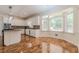 Bright kitchen with white cabinets, stainless steel appliances, and an island with a granite countertop at 5460 Lichenhearth Ct, Stone Mountain, GA 30087