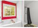 Bright bathroom with a soaking tub under a large window and a separate shower at 5885 Raventree Ct, South Fulton, GA 30349