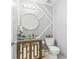 Stylish powder room featuring a vessel sink, modern mirror, and geometric wall design at 5885 Raventree Ct, South Fulton, GA 30349