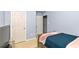 Cozy bedroom with a wood frame bed, side tables and a television at 5885 Raventree Ct, South Fulton, GA 30349