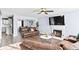 Inviting living room with a fireplace, ceiling fan and hardwood flooring throughout the home at 5885 Raventree Ct, South Fulton, GA 30349