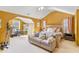 Spacious main bedroom featuring a sitting area, ensuite bath and neutral carpet at 5885 Raventree Ct, South Fulton, GA 30349