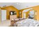 Spacious main bedroom featuring a large television, ensuite bath and neutral carpet at 5885 Raventree Ct, South Fulton, GA 30349