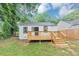 Cozy wooden deck complements the exterior and landscaped yard, perfect for outdoor enjoyment at 942 Lawton Sw St, Atlanta, GA 30310